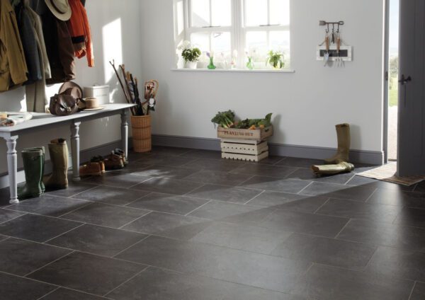 Landscape image of Art Select Stone Slate Canberra tiles laid in a regular pattern in a front room of a house